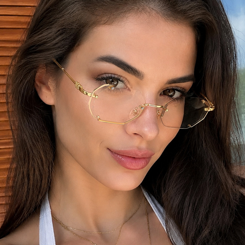Women Fashion Pose - Polygonal metal sunglasses retro personalized hollow